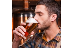 Image Man enjoying a beer.